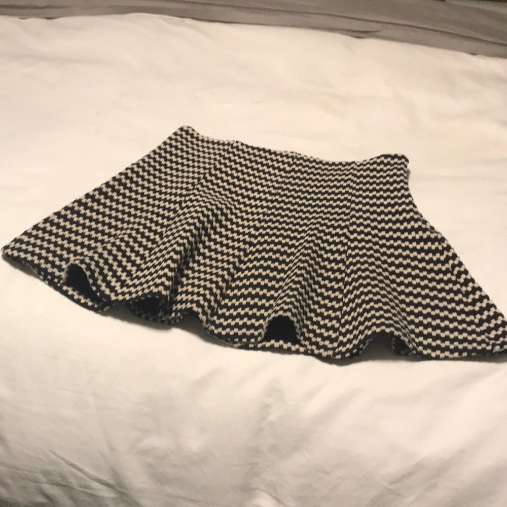 Black and white mini skirt.